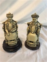 Two Resin Oriental Statues On Wooden Stands
