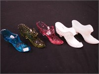 Five shoe figurines, some Fenton: blue, pink,