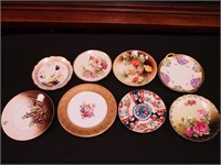 Eight vintage plates, mostly handpainted: