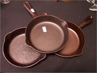 Three Griswold #3 skillets: one slant, all