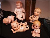 Six bisque contemporary small piano babies,
