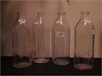 Four Tuffy glass baby bottles, 6 1/2" high