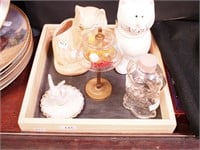Three small perfume bottles in a display in the
