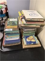 2 stacks of children’s and other books.
