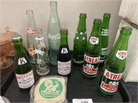 Vintage soda and beverage bottles.