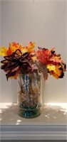 Fall Colored Faux Flowers in Large Glass Vase