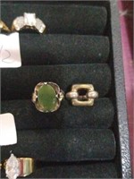 Pair of sterling rings. One with green stone