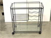 Small rolling wine rack with glass shelves
