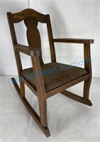 Antique oak child’s rocker with the original