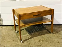 teak side table w/ drawer on castors