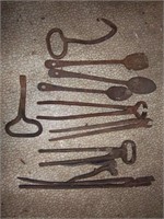 two bale hooks, forge tongs, spoons