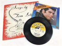John Travolta, The Beatles & Tom Lehrer Records