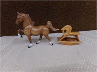Plastic horse and toy wood rocking horse