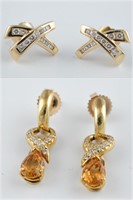 2 Pairs of 14k diamond earrings.