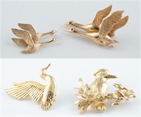 4 Gold bird brooches.