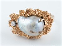 14k Cultured pearl and diamond ring.
