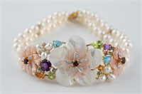 18k Pearl and multi colored gem bracelet.