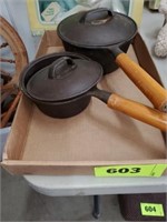 2 X'S BID CAST IRON POTS W/ WOOD HANDLES UNMARKED