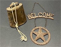 Cowbell And Rustic Welcome Sign