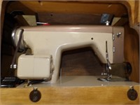 Sewing Machine in wood Cabinet