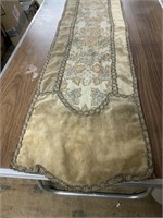 TABLE RUNNER ABOUT 4 FEET LONG AND 12 INCHES WIDE