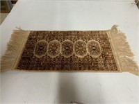 FRINGED MAT ABOUT 15 INCHES LONG