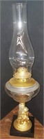 Antique oil lamp with little boy figure on base
