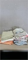 Assorted queen-size Sheets and pillowcases,
