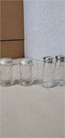 2 clear glass salt and pepper shakers