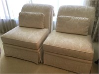 Two cream occasional chairs