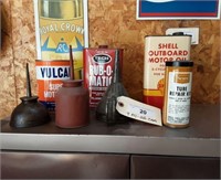 (7) pieces, oil cans.