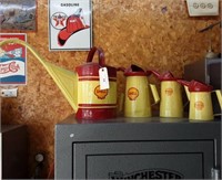 (4) Shell oil cans in various sizes.