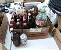 Box 0f Coke and Pepsi products.