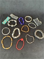 13 costume fashion stretch bracelets and one
