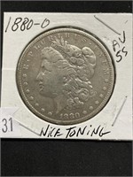1880-o Morgan Silver Dollar, Au. – 55 Toned