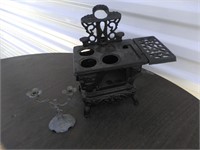 cast iron salesman sample stove and candle toy