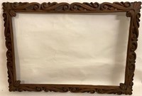 PAIR OF DEEPLY CARVED WOODEN FRAMES
