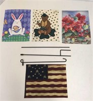 Several holiday yard flags & new flag holder