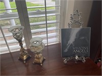 Two candle holders and book stand with book