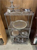Contents of shelf, silver plate trays and bowls