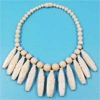 Beautiful bone beaded necklace with numerous faces