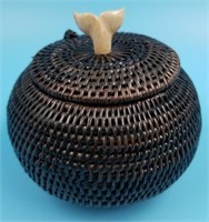 Hinged lidded root basket with a mammoth ivory wha
