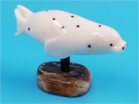 Ivory carving of a sea lion with baleen inset eyes