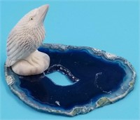 Moose antler carving of a bird on geode slab with