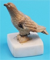 Roger Silook fossilized carving of an eagle on raw