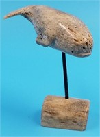 Facsimiled whale bone carving of a whale, artist s