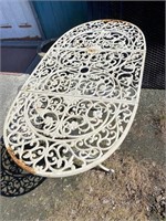 Cast-iron table. Paint it any color you like. 53”
