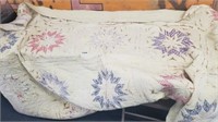 ANTIQUE QUILT WITH AGE STAINS