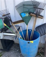 Lot of assorted brushes and rakes bucket not