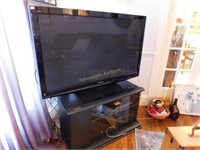 Panasonic 55" tv flat screen w/Sauder cabinet/stan